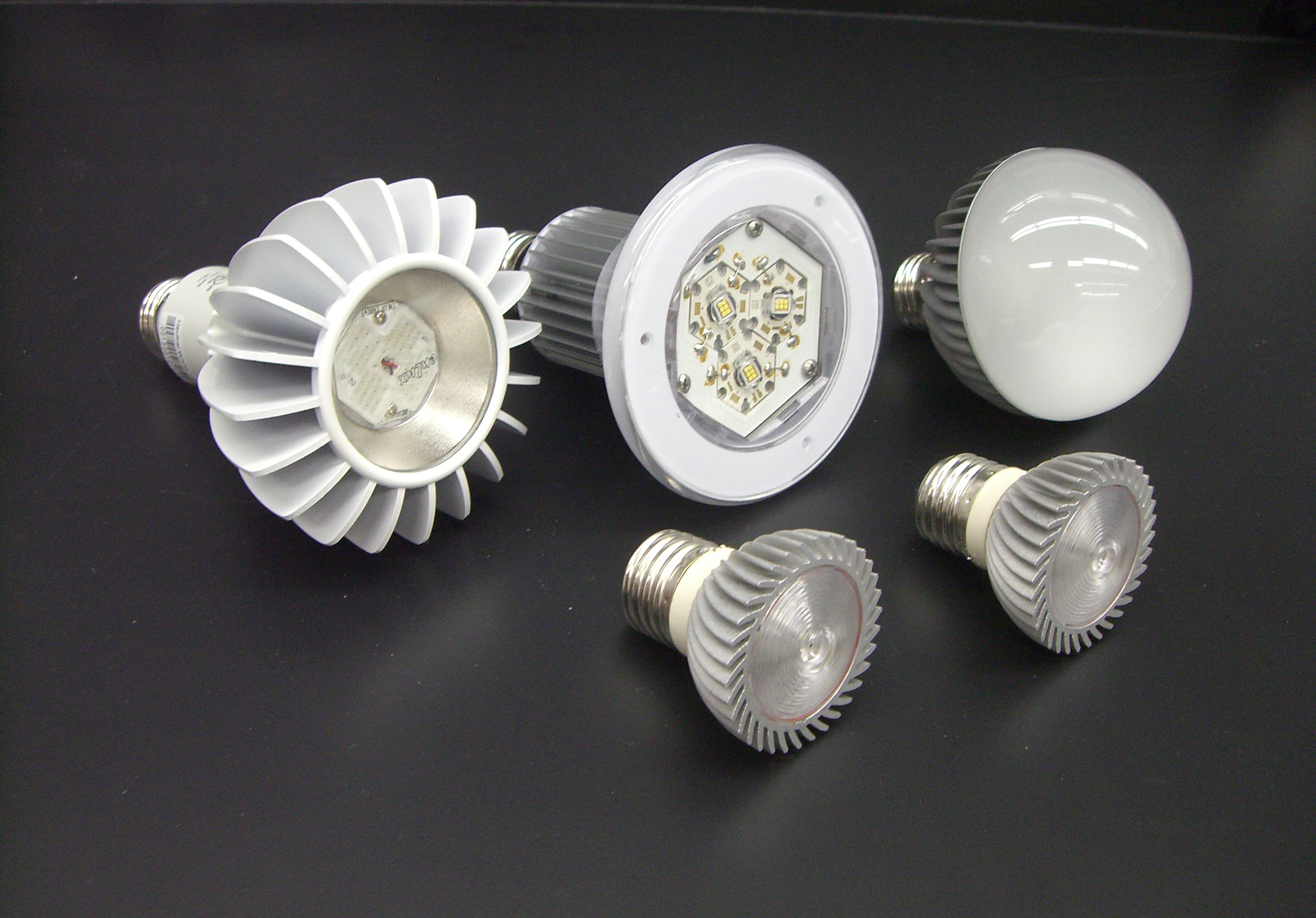 Five unlit early LED replacement lamps with heat sinks and exposed LED emitter boards