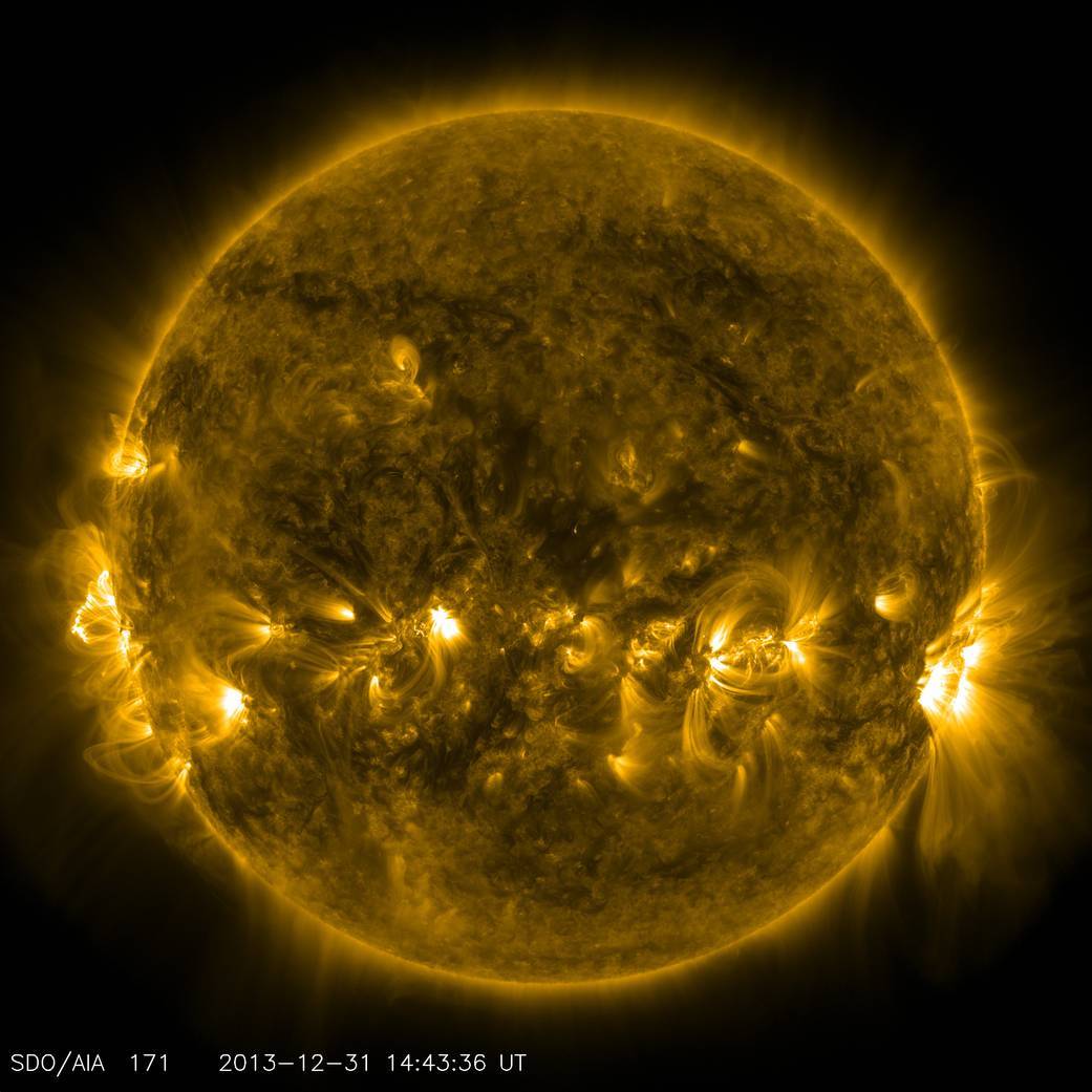 False-color extreme-ultraviolet view of the Sun showing bright coronal loops